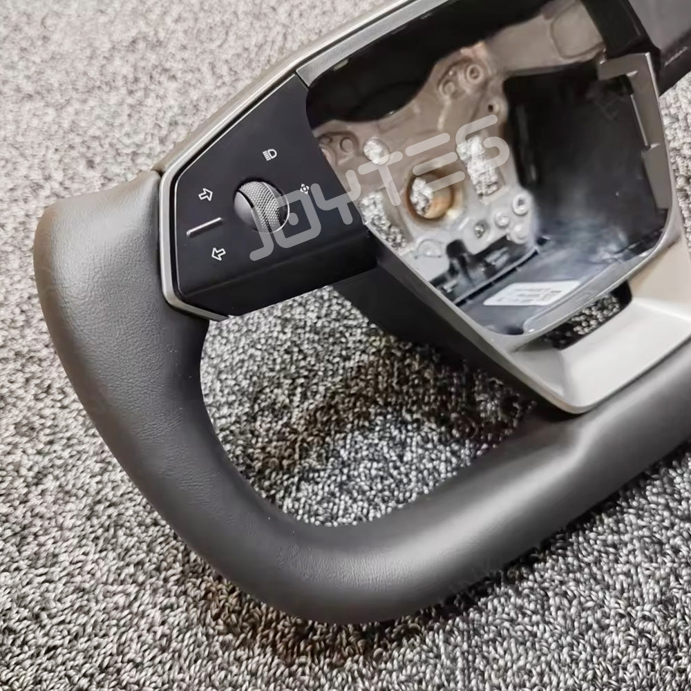 white tesla yoke steering wheel