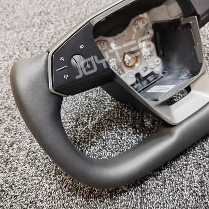 white tesla yoke steering wheel